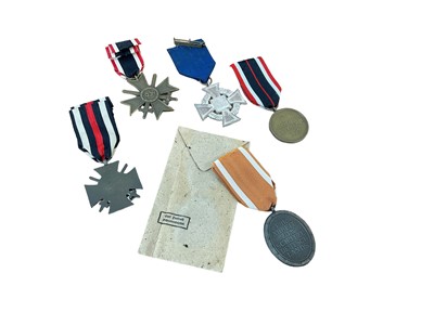 Lot 794 - Nazi German Defences medal, a Nazi War Merit Cross (with swords), Nazi Faithful Service decoration, and two other German medals (5 medals)