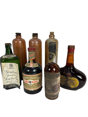 Lot 21 - Seven bottles, including Gordon's gin, 1950s-60s, Drambuie, Apricot Brandy and three bottles of Dutch Bols in stoneware bottles