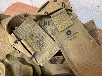Lot 796 - Second World War American Army canvas webbing covered water bottle, belt, pouches and other webbing items including a gas mask in case (1 box).