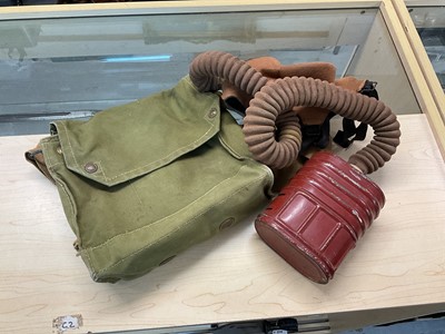 Lot 796 - Second World War American Army canvas webbing covered water bottle, belt, pouches and other webbing items including a gas mask in case (1 box).