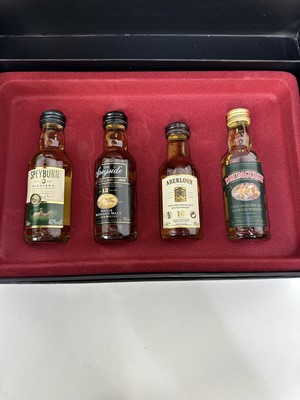 Lot 46 - Group of whisky to include, Ballantine's Gold Seal 12 years old, boxed, Famous Grouse Wade Highland Decanter, Dimple 15 years old, boxed, Beswick Beneagles decanter (empty), Montague's boxed set of...
