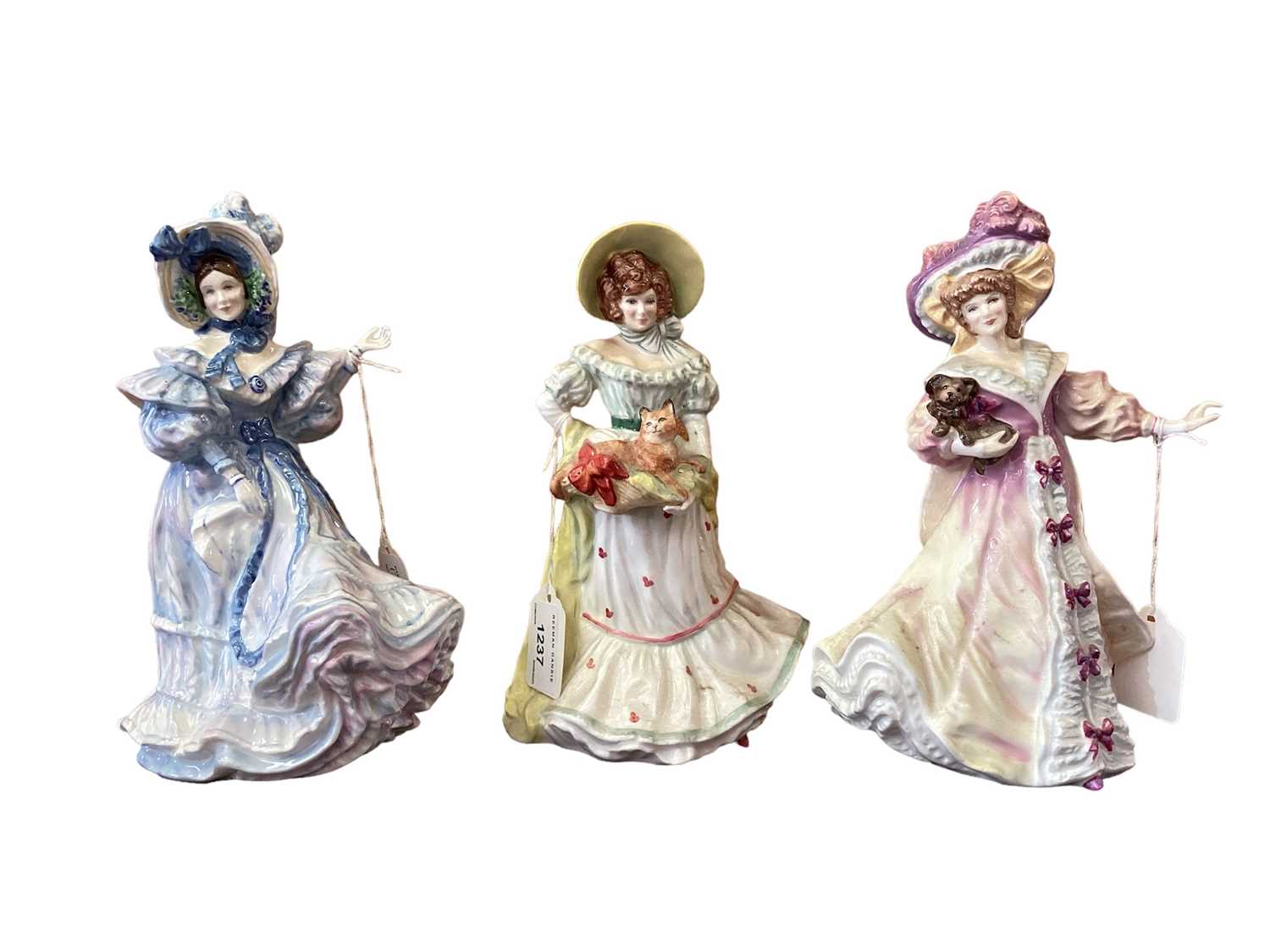 Lot 1237 - Ten Royal Doulton figures - Jane HN3711, Lily HN3626, Flower Arranging HN3040, Claire HN3209, Hilary HN2335, Forget-Me-Nots HN3700, Alice HN3368, Ellie HN4017, The Recital HN4466 and Amy HN4760