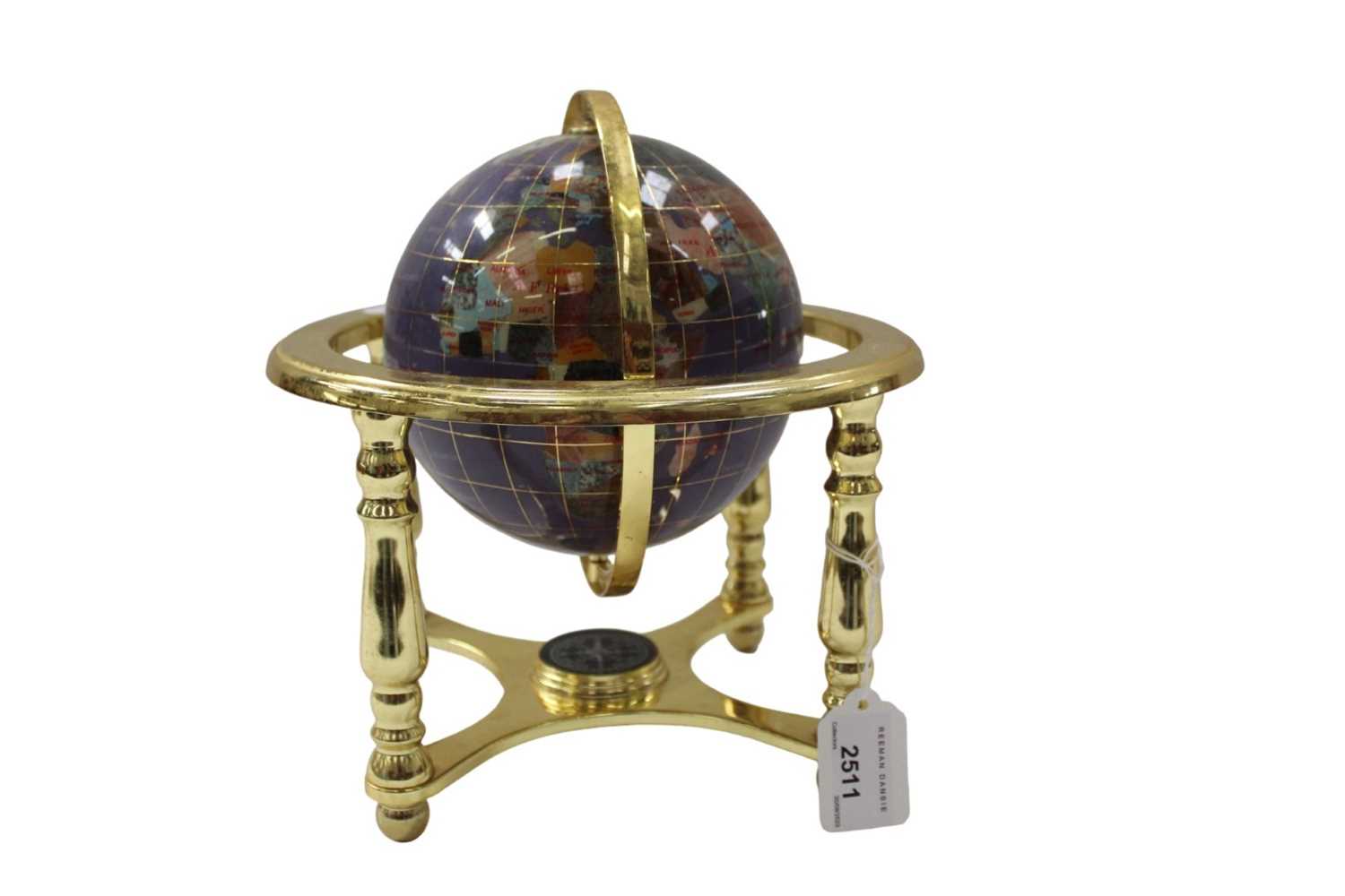 Lot 2511 - Small inlaid hard stone table top globe.