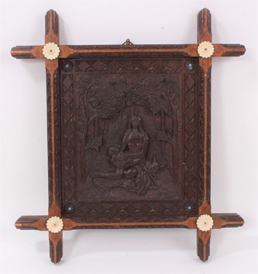 Lot 717 - Unusual naive relief carved oak panel with mother, child and calf