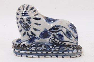 Lot 124 - Naive blue and white glazed lion mantel piece figure