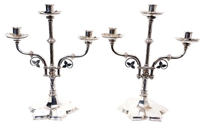 Lot 202 - Manner of Pugin: pair of late 19th century Gothic-style plated silver candlesticks