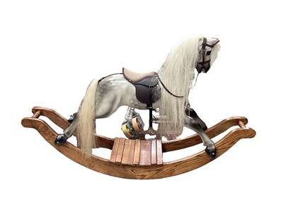 Lot 2660 - Rocking horse on sleigh base made by horsecraft real horse hair leather saddle grey dapple colour 180cm x 110cm