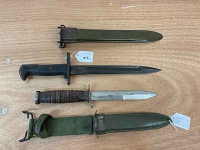 Lot 913 - Second World War American bayonet with scabbard dated 1943 and American fighting knife in sheath with canvas frog (2)