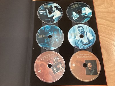 Lot 2217 - Box of Queen related items including 7 inch singles (Queen DJ 95 - purple vinyl limited edition, etc), 12 inch singles and books (40 Years of Queen and The Neal Preston Photographs, etc), together...