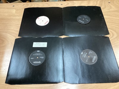 Lot 2217 - Box of Queen related items including 7 inch singles (Queen DJ 95 - purple vinyl limited edition, etc), 12 inch singles and books (40 Years of Queen and The Neal Preston Photographs, etc), together...