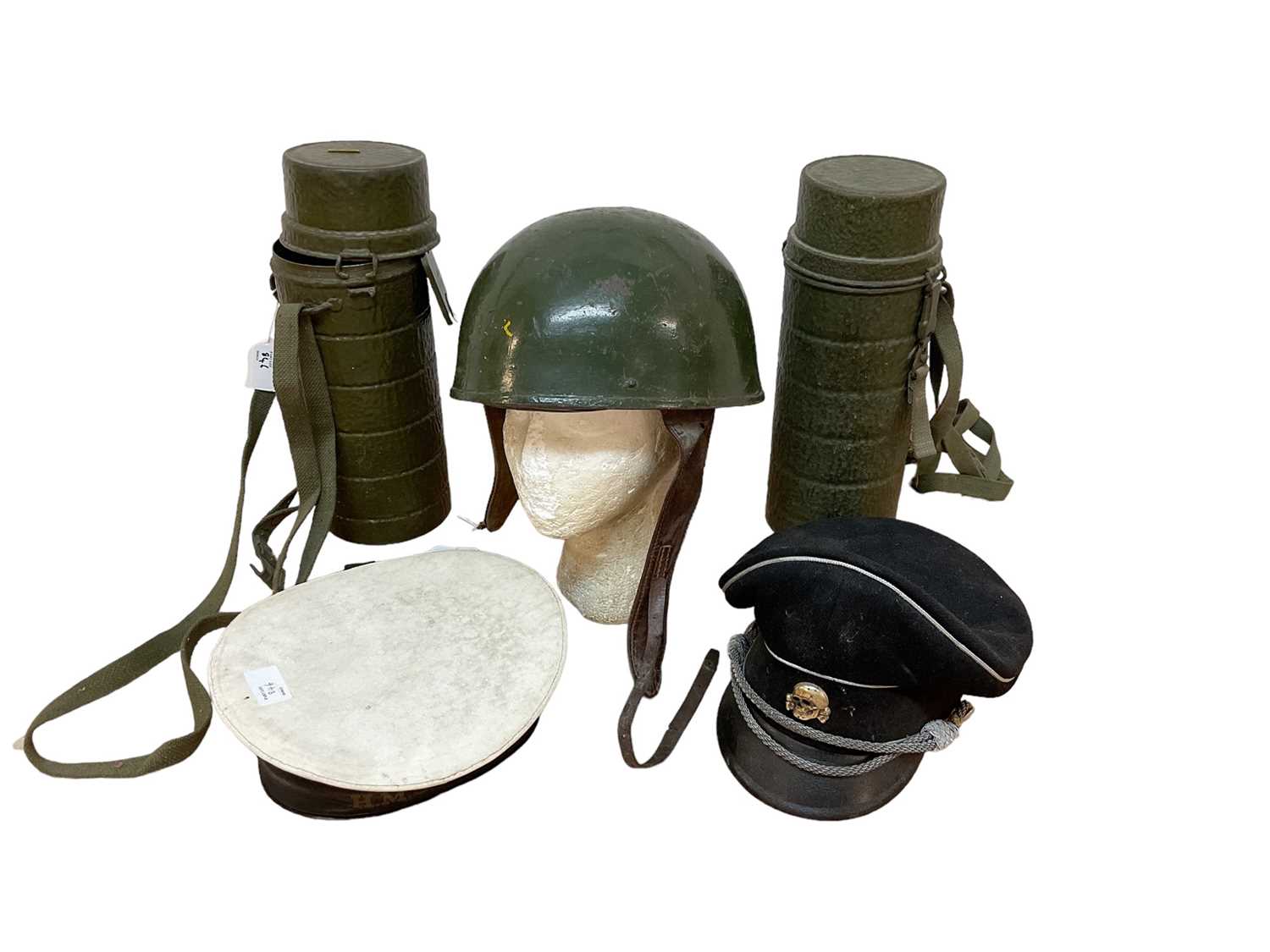 Lot 846 - Second World War British despatch riders helmet dated 1944 with BMB ( Briggs Motor Bodies) manufacturers mark , original green paint and leather liner and two other caps (3)