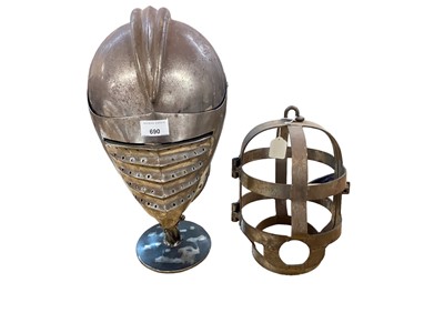 Lot 690 - Reproduction steel knights helm with fluted face guard on stand  and reproduction torture/ chastity helmet (2)