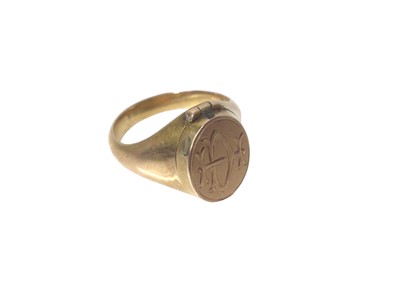 Lot 160 - Victorian yellow metal signet ring with engraved initials and hinged locket compartment