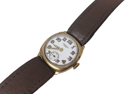 Lot 163 - 1930s 9ct gold cushion shaped wristwatch by J W Benson on leather strap