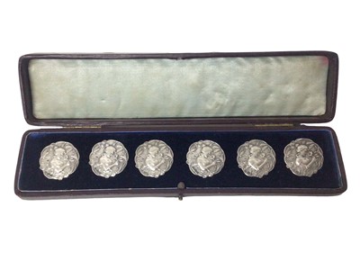 Lot 184 - Set Six French Art Nouveau silver buttons with import marks for 1905 in original fitted maroon leather case