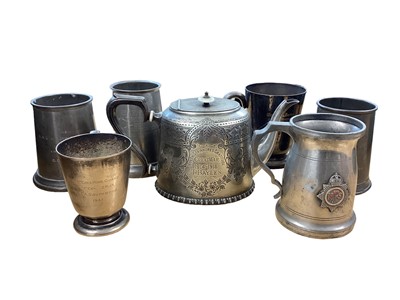 Lot 674 - Military interest- two boxes of pewter tankards with engraved military presentation inscriptions (2 boxes).