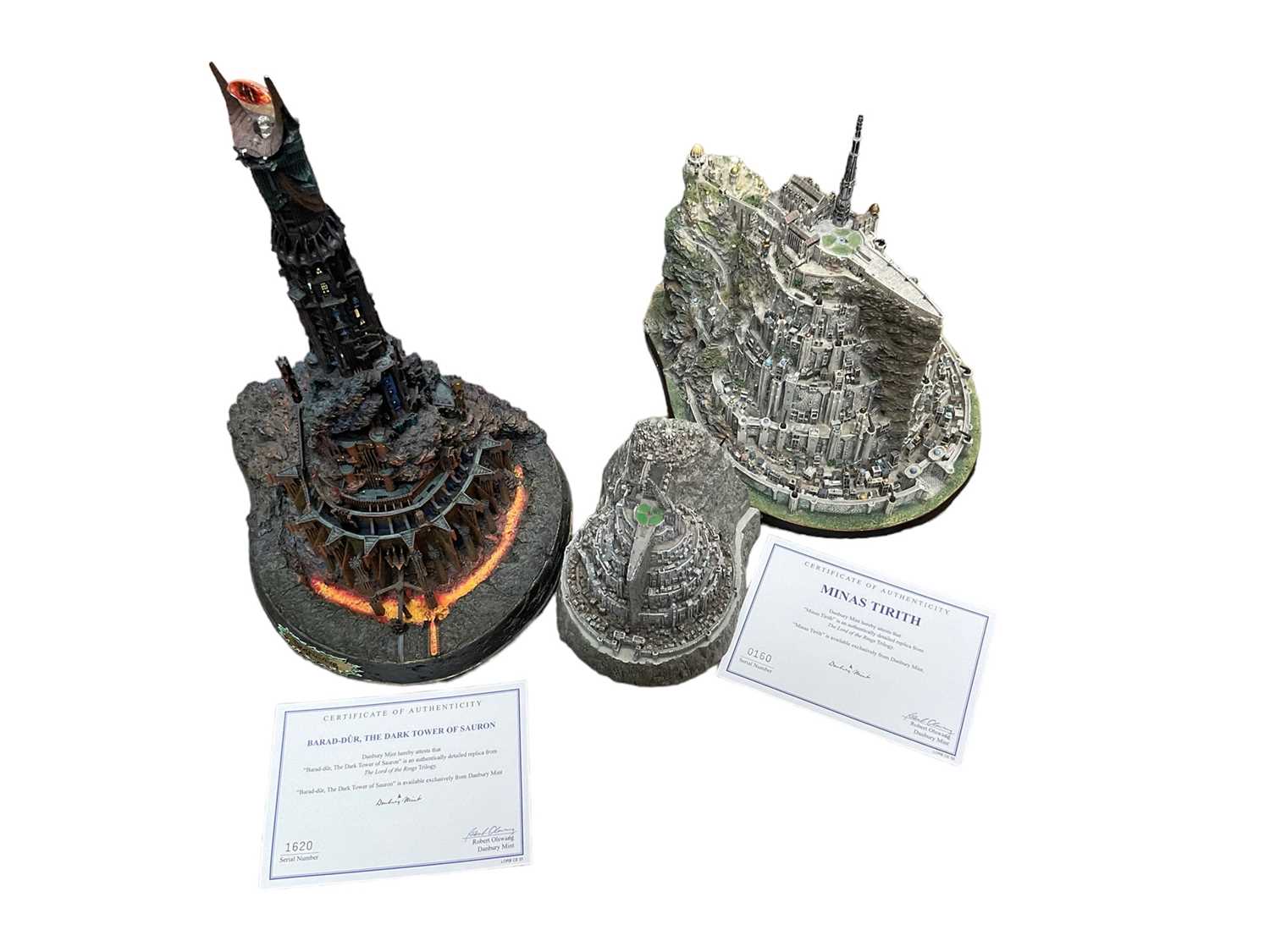 Lot 2577 - Danbury Mint Lord of the Rings models of the two towers, with certificates and a smaller model