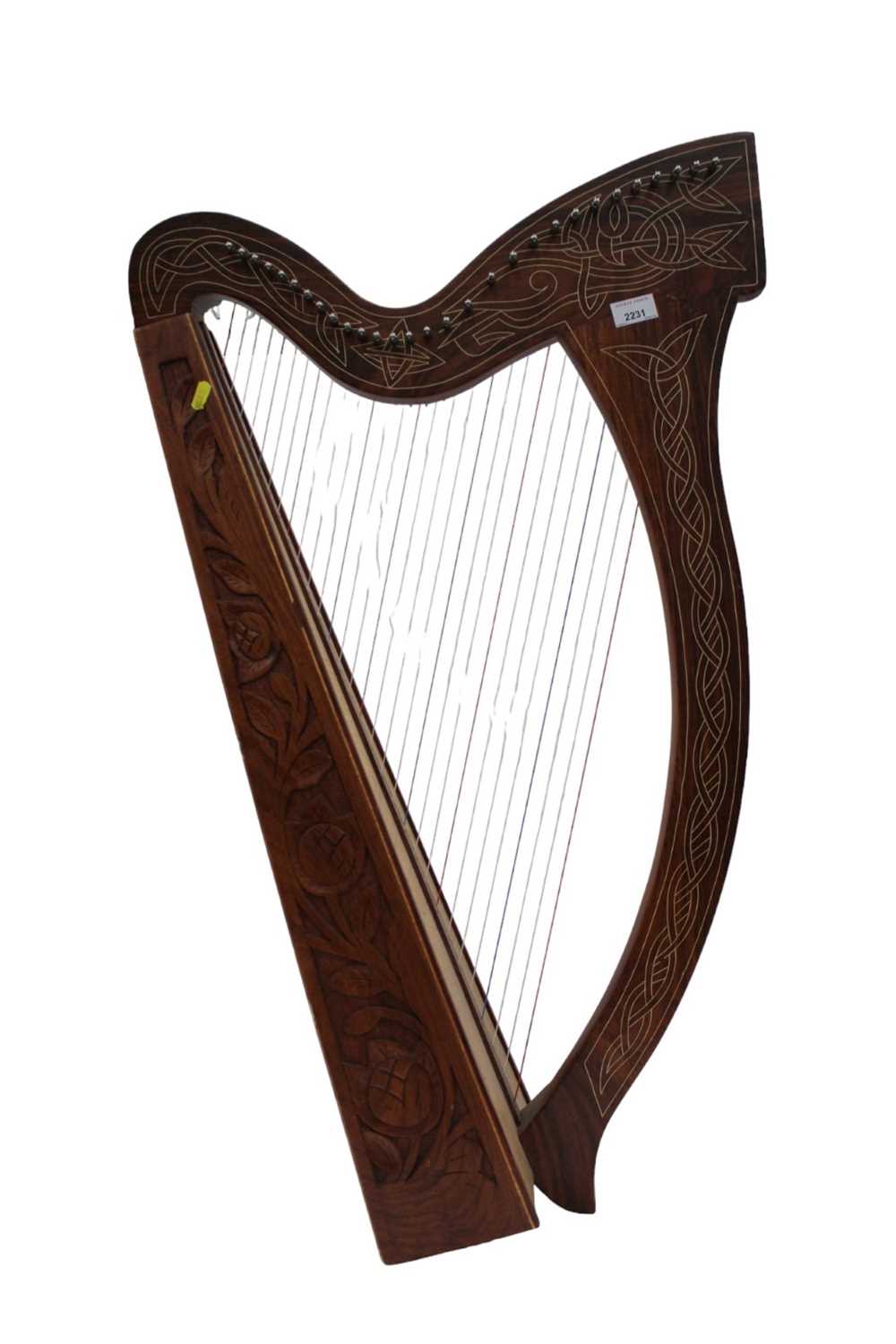 Lot 2231 - Contemporary wooden harp with carved decoration.