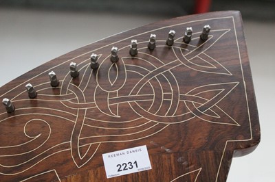 Lot 2231 - Contemporary wooden harp with carved decoration.