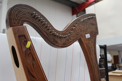 Lot 2231 - Contemporary wooden harp with carved decoration.