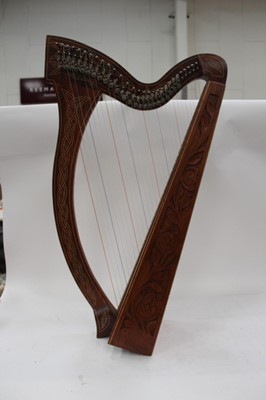 Lot 2231 - Contemporary wooden harp with carved decoration.