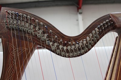 Lot 2231 - Contemporary wooden harp with carved decoration.