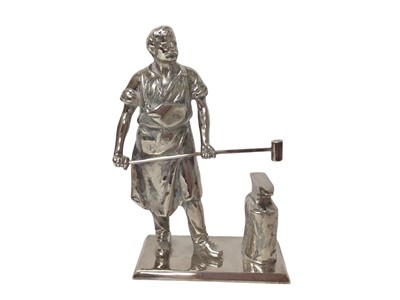 Lot 317 - Silver plated figure of a blacksmith