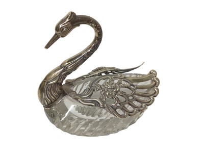 Lot 316 - Good quality cut glass swan with silver head, neck and wings which spread out, marked 925 on wings