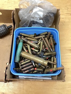 Lot 670 - Three boxes of brass military shell and bullet cases, together with a dummy stick grenade (3 boxes)