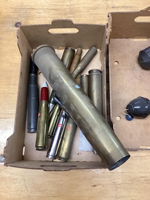 Lot 670 - Three boxes of brass military shell and bullet cases, together with a dummy stick grenade (3 boxes)