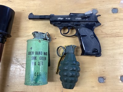 Lot 670 - Three boxes of brass military shell and bullet cases, together with a dummy stick grenade (3 boxes)
