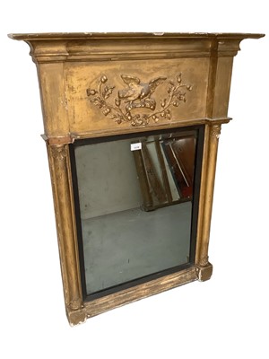 Lot 1178 - Regency gilt framed pier mirror with moulded eagle and thistle panel above a mirrored plate flanked by columns, 75cm wide x 96cm high