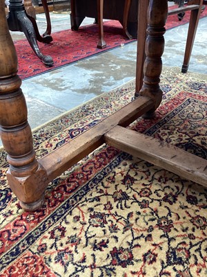 Lot 1180 - French-style chestnut farmhouse table with single drawer, turned legs joined by stretchers, 179cm long x 70cm wide x 77cm high