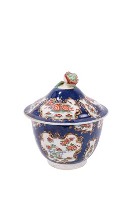 Lot 128 - A Worcester blue scale sucrier and cover, decorated in Kakiemon style, circa 1770