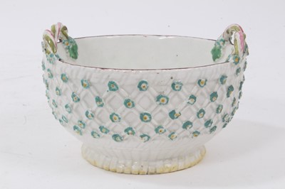 Lot 65 - A Derby two handled basket, the exterior applied with flower heads, circa 1760