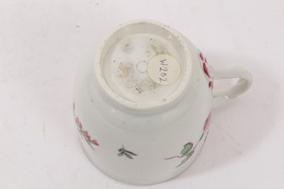 Lot 67 - An unusual Worcester coffee cup, with entwined handle, painted with flowers, circa 1770
