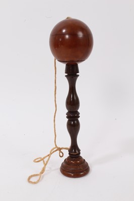 Lot 706 - Victorian ball in the cup game carved from a nut