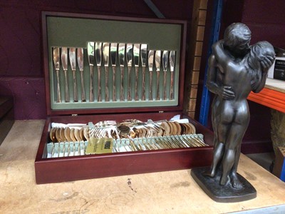 Lot 750 - Cased full set of brass Viners cutlery together with two lovers kissing statue