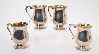 Lot 236 - Set of four silver baluster mugs