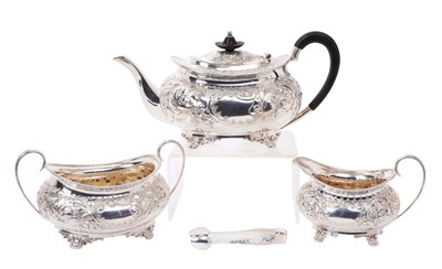 Lot 215 - Early 20th century silver embossed three piece teaset