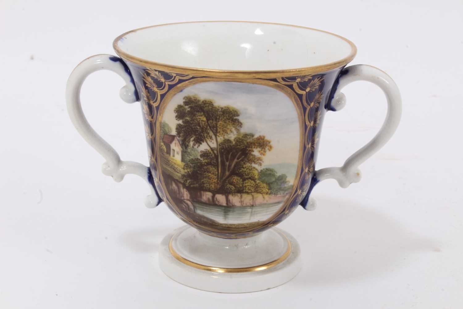 Lot 79 - A Derby blue ground two handled cup, circa 1820