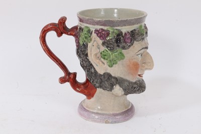 Lot 87 - A pearlware Bacchus mask mug, circa 1800