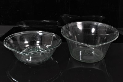 Lot 10 - A pair of Rare Georgian glass pouring bowls possibly for cream separation with heavy folded rims and broken pontils.