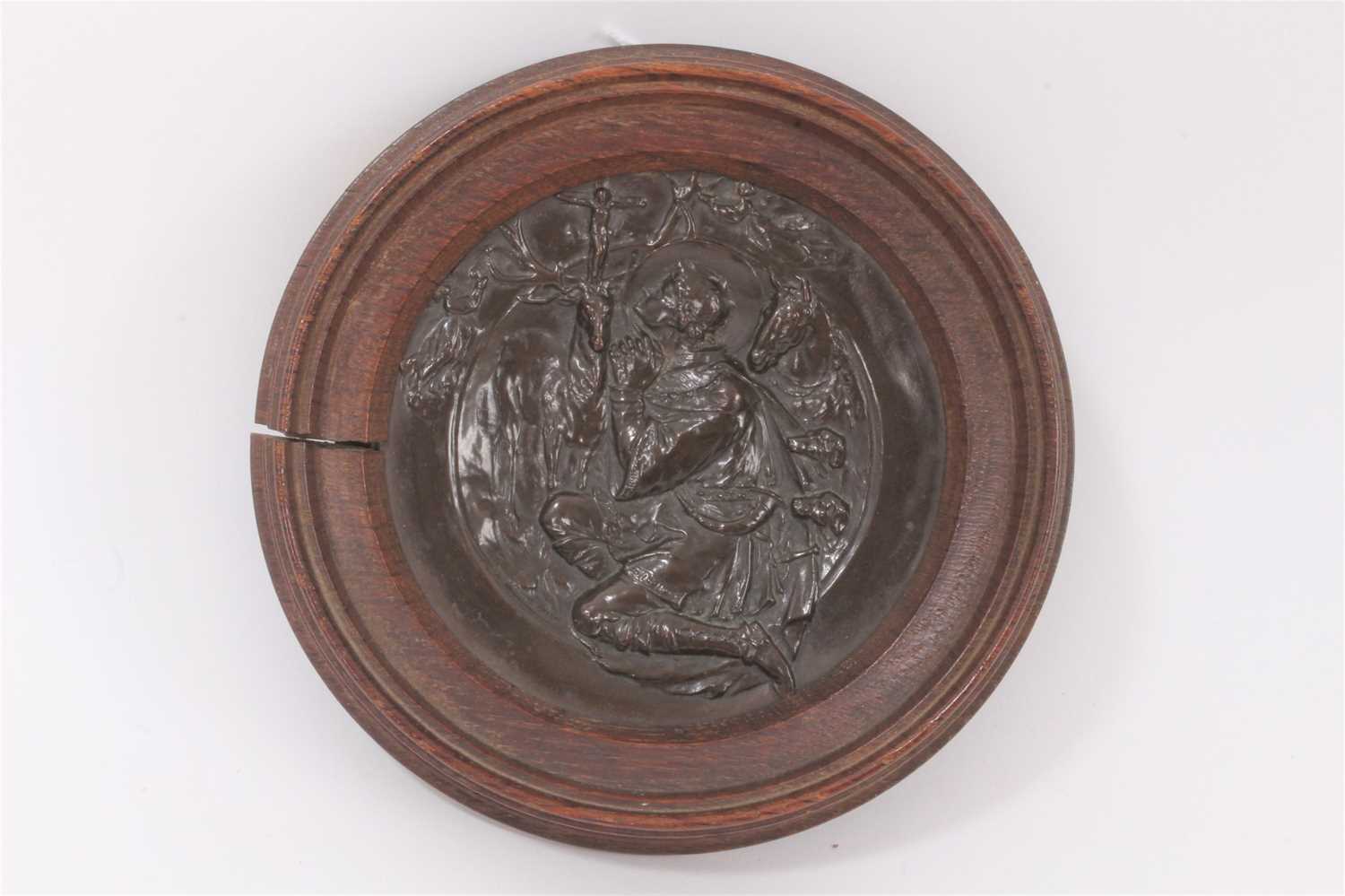 Lot 708 - Walter Gilbert, Bromsgrove Guild of Handicrafts, Arts and Crafts bronze plaque depicting a religious scene of St Hubert, mounted in a wooden frame