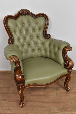 Lot 1064 - Victorian style leather upholstered tub armchair, with carved show wood frame