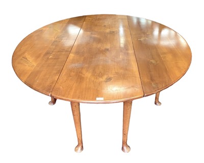 Lot 1072 - Georgian style cherrywood wakes table, elliptical drop leaf top on turned legs and pad feet, 198 x 152cm