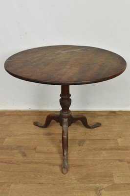 Lot 1076 - George III mahogany occasional table, with solid circular tilt-top on tripod cabriole supports and pad feet, 86cm diameter