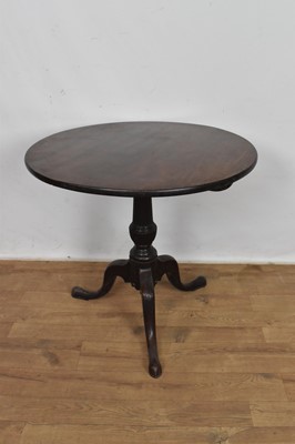 Lot 1077 - George III mahogany and later carved occasional table, with solid circular tilt top on fluted carved column and tripod cabriole legs and pad feet, 75cm diameter