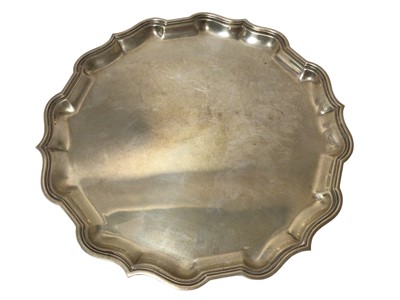 Lot 204 - 1940s silver salver of hexagonal form, with pie crust border, on three paw feet
