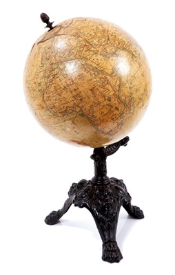 Lot 671 - Late 19th/early 20th century French terrestrial table globe, retailed by A. Brown & Sons, Hull and York, supported on an ornate cast iron base with mask and scroll decoration, raised on three paw...